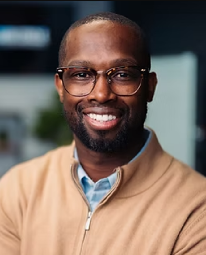 headshot of man with glasses